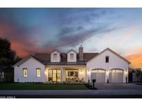 Beautiful exterior of a luxury home with manicured lawn, arched garage doors and welcoming front porch at 3634 N 47Th St, Phoenix, AZ 85018