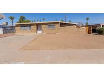 Charming single-story brick home featuring a well-maintained exterior and a spacious front yard at 3644 W Townley Ave, Phoenix, AZ 85051