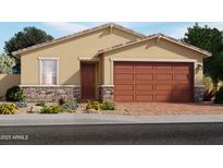 Charming single-story home with a two-car garage, stone accents, and a landscaped front yard at 3819 S 87Th Dr, Tolleson, AZ 85353