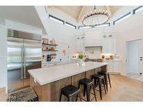 Bright kitchen with stainless steel appliances, expansive island, and modern lighting fixture at 5045 E Calle Del Sol --, Cave Creek, AZ 85331