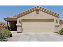 Charming single-Gathering home features a two-car garage and well-maintained landscaping at 17914 N Fiano Dr, Maricopa, AZ 85138