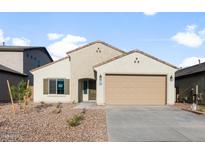Beige single-story home with desert landscaping and a two-car garage at 2649 N Riverside Dr, Florence, AZ 85132
