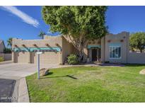 Charming single-story home with a well-manicured lawn and eye-catching architectural details at 5345 E Mclellan Rd # 83, Mesa, AZ 85205