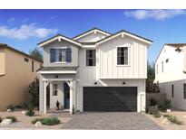 Charming two-story home featuring mixed siding, a dark two-car garage, and low-maintenance desert landscaping at 7987 W Griswold Rd, Peoria, AZ 85345