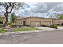 Charming single-story home with a two-car garage, beautiful landscaping, and neutral color palette at 8347 W Taro Ln, Peoria, AZ 85382