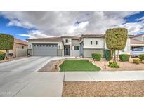 Charming single Gathering home with a two-car garage and landscaped front yard at 19736 E Emperor Blvd, Queen Creek, AZ 85142