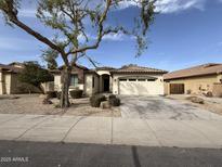 Charming single-story home features a well-maintained landscaped yard with mature trees at 2146 E Aloe Pl, Chandler, AZ 85286