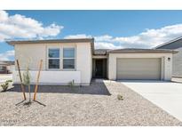 Inviting single-story home with a well-maintained front yard and attached two-car garage at 2707 E Abe Truckle Ave, San Tan Valley, AZ 85140