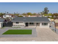 Charming single story home with xeriscape front yard and basketball hoop at 2212 E Hillery Dr, Phoenix, AZ 85022