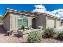 Charming single-story home with a neutral color scheme and a well-manicured front yard at 3117 S Signal Butte Rd # 501, Mesa, AZ 85212