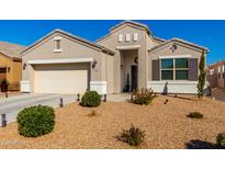 Charming single-story home featuring a two-car garage and desert landscaping at 5026 E Andalusite Ln, San Tan Valley, AZ 85143