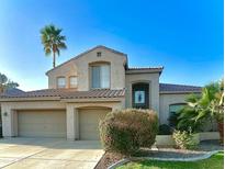 Charming two-story home with a well-manicured lawn, desert landscaping, and a spacious three-car garage at 641 W Oriole Way, Chandler, AZ 85286