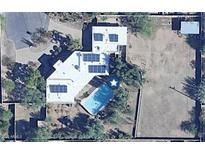 Expansive property featuring a refreshing pool, tennis court, and solar panels at 11823 N 76Th Way, Scottsdale, AZ 85260