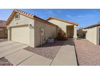 Charming single-story home featuring a two-car garage, low maintenance landscaping, and a cozy front porch at 3032 W Matthew Dr, Phoenix, AZ 85027