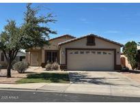 Charming single-story home featuring a well-maintained front yard, a two-car garage and a cozy, inviting curb appeal at 8929 E Bramble Ave, Mesa, AZ 85208