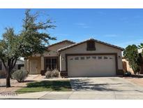 Charming single-story home featuring a two-car garage and well-maintained landscaping at 8929 E Bramble Ave, Mesa, AZ 85208
