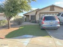 Charming single-story home with well-maintained lawn, mature tree, and inviting curb appeal at 8929 E Bramble Ave, Mesa, AZ 85208