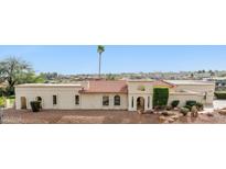 Expansive single-story home showcasing desert landscaping and a red tile roof against a clear blue sky at 16611 E Inca Ave, Fountain Hills, AZ 85268