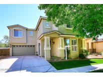 Charming two-story home featuring a well-maintained front yard and attached two-car garage in a suburban neighborhood at 1839 E Donner Dr, Phoenix, AZ 85042