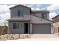 Charming two-story home showcasing a gray exterior, complemented by a well-maintained front yard at 40218 N Alegre Dr, San Tan Valley, AZ 85140