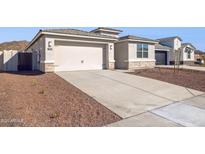 Charming home featuring a two-car garage, concrete driveway, and stone accents at 7378 W Whitehorn Trl, Peoria, AZ 85383