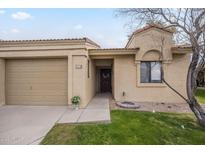 Charming single-story home featuring a beige exterior, front lawn and a well-manicured landscape at 1021 S Greenfield Rd # 1213, Mesa, AZ 85206