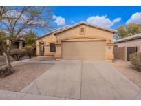 Charming single story house with neutral tan color scheme and a well maintained front yard at 1100 E Canyon Trl, San Tan Valley, AZ 85143