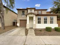Charming two-story home with a well-manicured front yard and neutral-toned exterior at 1420 E Sonrisas St, Phoenix, AZ 85040