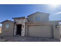 Charming single-Gathering home with a two-car garage, stone accents, and a well-maintained yard at 5405 W Jackalope Ln, Laveen, AZ 85339
