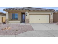 Inviting single-Gathering home with tan stucco, tile roof, and attached two-car garage at 10329 N 115Th Ave, Youngtown, AZ 85363