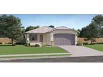Charming single-story home with a well-manicured lawn and attached two-car garage at 16743 W Alameda Rd, Surprise, AZ 85387