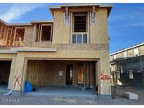 Two-story townhome under construction featuring an attached two-car garage at 21068 N 58Th St, Phoenix, AZ 85054