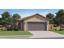 Charming single-story home featuring a two-car garage, desert landscaping, and a welcoming entrance at 25069 N 174Th Ln, Surprise, AZ 85387