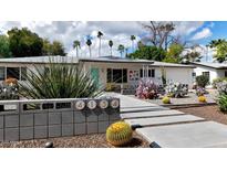 Charming single-story home featuring desert landscaping and a colorful facade with eye-catching accents at 4134 N 35Th St, Phoenix, AZ 85018