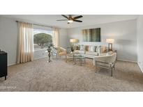 Inviting living room featuring stylish seating arrangements, decorative wall art, and natural light at 6217 E El Paso St, Mesa, AZ 85205