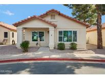 Charming single-story home with a well-manicured lawn and inviting entrance, located in a peaceful neighborhood at 1120 N Val Vista Dr # 2, Gilbert, AZ 85234