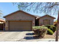 Charming single-story home with a two-car garage and well-manicured front yard at 273 S 152Nd Ave, Goodyear, AZ 85338