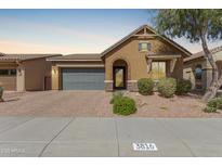 Charming single-story home featuring an attached garage and desert-style landscaping at 3816 E Rakestraw Ln, Gilbert, AZ 85298