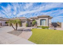 Stunning single-story home boasts lush turf, mature landscaping, and gated entry at 3948 E Vallejo Dr, Gilbert, AZ 85298