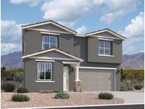 Charming two-story home featuring a two-car garage, neutral stucco, and a meticulously landscaped front yard at 9613 W Parkway Dr, Tolleson, AZ 85353
