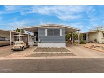 Charming home exterior featuring a covered carport and well-maintained landscaping at 2650 W Union Hills Dr # 329, Phoenix, AZ 85027