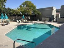 Sparkling community pool with clear water and ample seating areas for relaxation and enjoyment at 3309 N 70Th St # 108, Scottsdale, AZ 85251