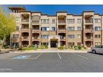 Beautiful multi-story condo building with a stone facade, covered balconies, and well-maintained landscaping at 5350 E Deer Valley Dr # 4408, Phoenix, AZ 85054