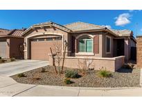 Charming single-story home with desert landscaping and a two-car garage at 7410 S 22Nd Ln, Phoenix, AZ 85041