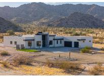 Striking desert home boasts modern architecture and a circular driveway at 15574 N Brielles Way, Maricopa, AZ 85139