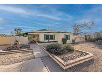 Charming single-story home featuring desert landscaping and a well-maintained yard at 1721 W Weldon Ave, Phoenix, AZ 85015