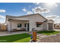 Charming single-story home with a well-manicured lawn, neutral paint, and stylish modern details at 1841 E Clarendon Ave, Phoenix, AZ 85016