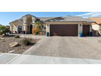 Charming home with a well-manicured yard, desert landscaping and a spacious three car garage at 2608 Leisure World --, Mesa, AZ 85206