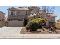 Charming two-story home featuring a neutral palette, landscaped front yard, and convenient two-car garage at 2811 W Glenhaven Dr, Phoenix, AZ 85045