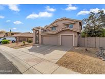 Two-story home featuring a neutral stucco exterior, tile roof, and a spacious three-car garage at 4607 E Rancho Laredo Dr, Cave Creek, AZ 85331